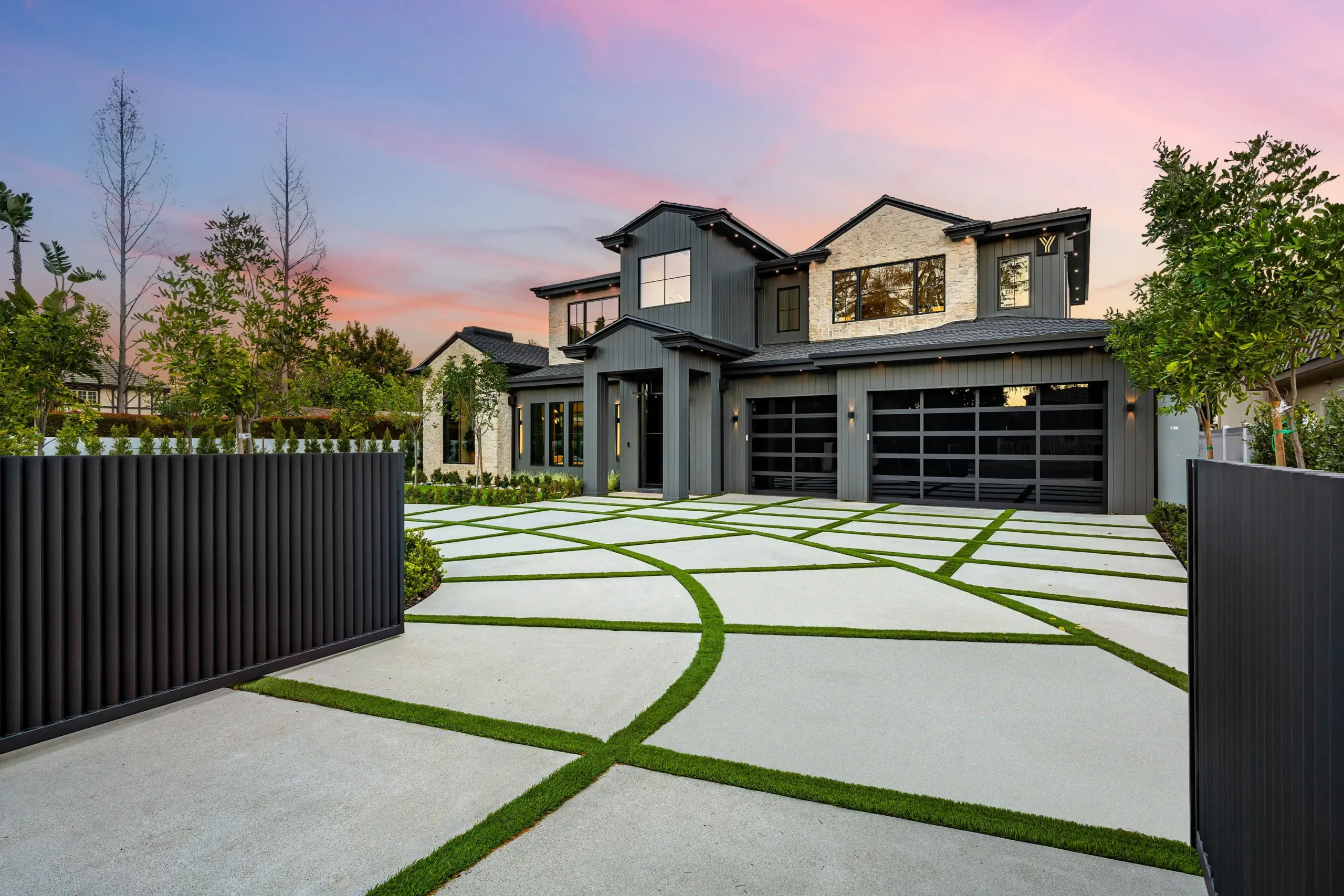 Modern Home with Custom Concrete Driveway and Grass Inlays at Sunset